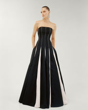 STRAPLESS A-LINE TAFFETA DRESS WITH PIPING PLEATED DETAIL